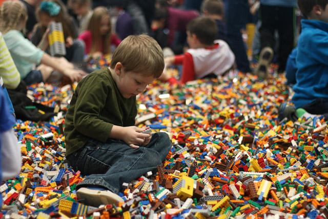 Families and children assembled Saturday at the Raleigh Convention Center at the LEGO KidsFest. The LEGO Fest featured a LEGO Model Museum of characters from fiction. Also featured was a brick pile for children to dive in and put bricks together. Two LEGO Master Builders, Steve Gerling and Chris Steininger, were present to teach tools of the trade that they have learned through their years of building with LEGOs. Gerling and Steininger built most of the models displayed in the Model Museum. As visitors exited the LEGO Fest, they had the opportunity to build a section of the United States and have it placed on a 65 feet long by 45 feet wide. Visitors could view this visitor-made model from a balcony.