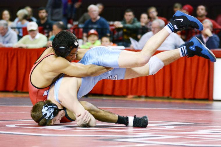 Freshman Chris Wilkes (133) pulls North Carolina&#8217;s Trou Heilmann to the ground. Wilkes pulled an upset over Heilmann to help the Wolfpack beat the Tar Heels, 19-16, Jan. 31 in Reynolds Coliseum.