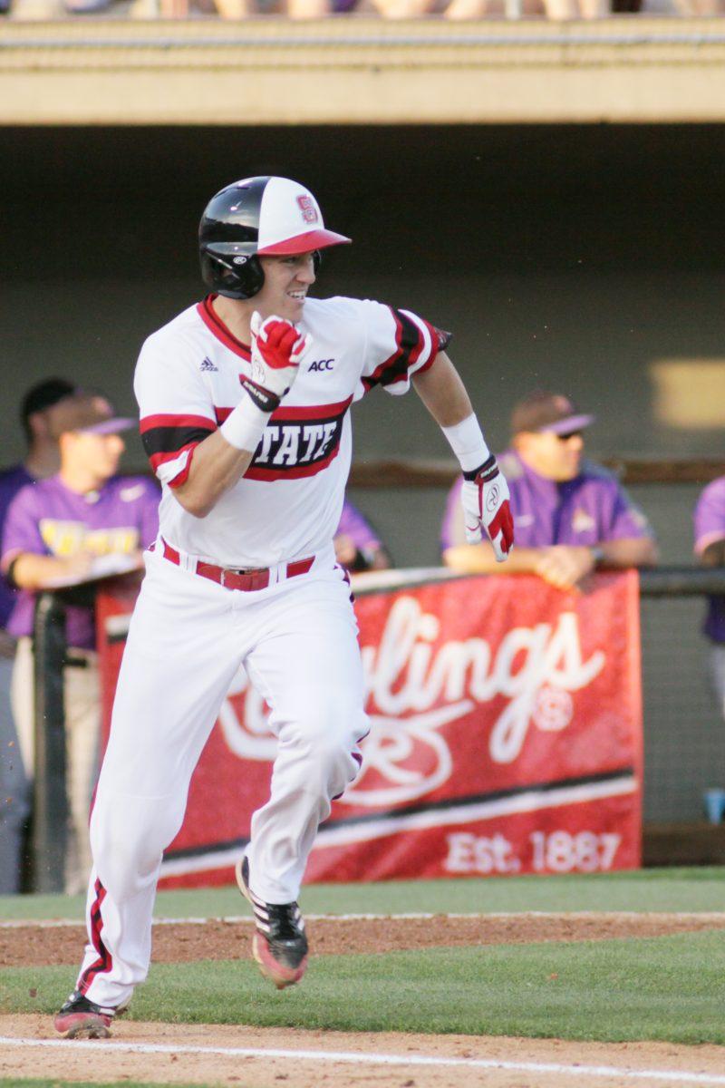 Junior second baseman Logan Ratledge runs to first base during N.C. State&#8217;s 3-2 victory over East Carolina Wednesday afternoon at Doak Field in Raleigh.