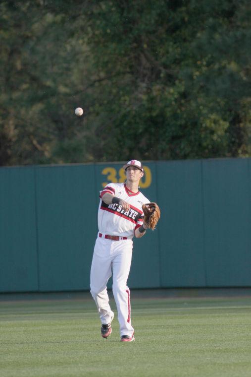 Junior right fielder Jake Armstrong throws the ball into the infield during N.C. State 3-2 victory over East Carolina Wednesday afternoon.