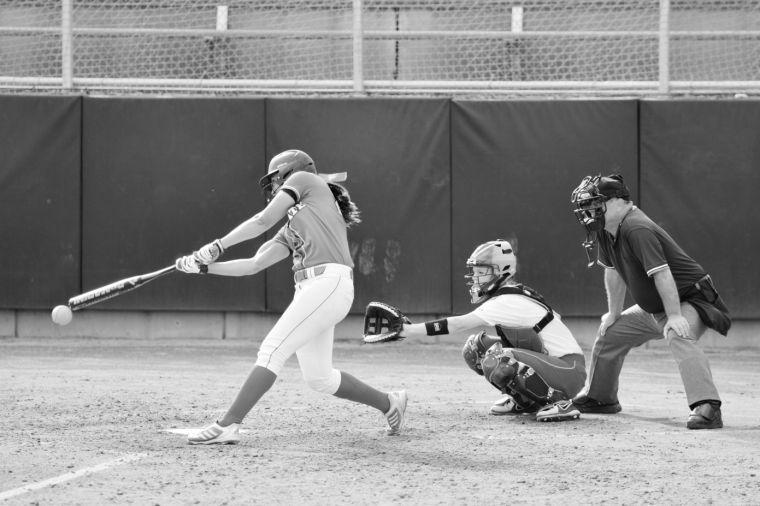 Senior centerfielder Scout Albertson makes contact with a ball that would shortly glide over the left field wall during the first of game of a doubleheader with East Carolina at the Curtis &amp; Jacqueline Dail Softball Stadium Wednesday.&#160; The Wolfpack swept the Pirates, bringing its record to 25-10 overall, with just a single loss at home.