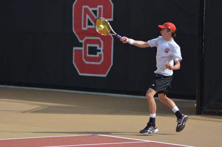 Junior Robbie Mudge hits a forehand return during his singles match with Boston College's Jonathan Raude at the J.W. Isenhour Tennis Complex April 4.