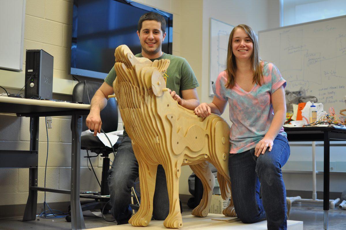 Kevin Young and Michelle Phillips, both seniors in mechanical engineering, display their senior-design project, The Timber-Wolf. The Timber-Wolf is an animatronic structure which will be displayed in the Hunt Library. Photo by Elizabeth Davis