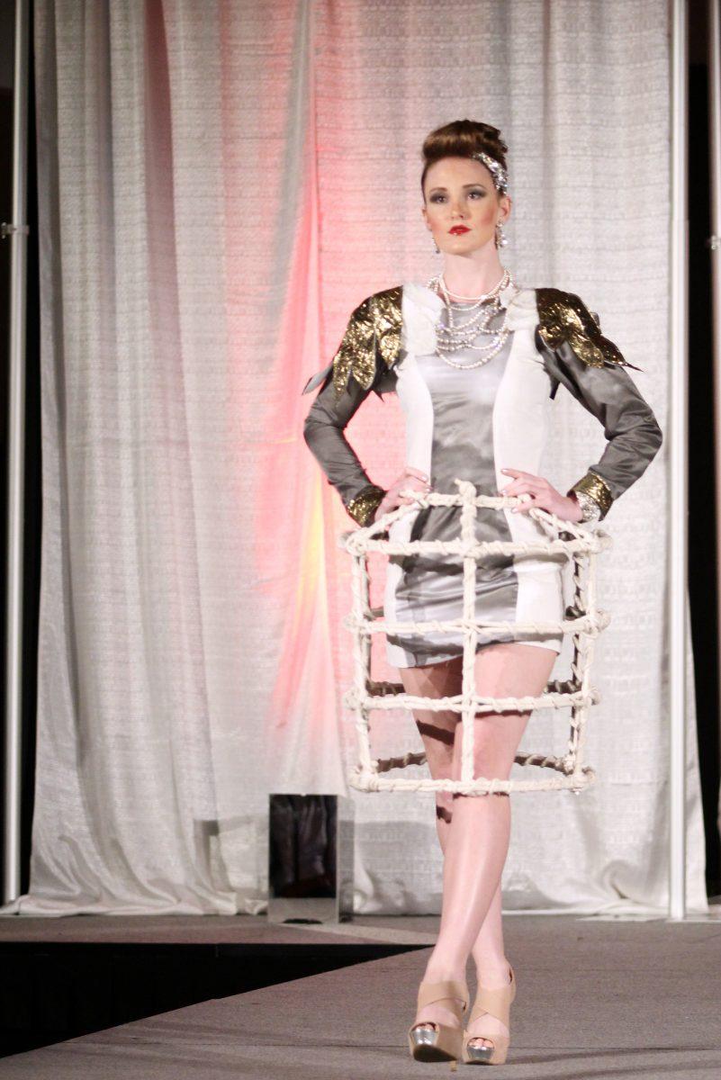 Alexia Lipscomb, junior in paper science and engineering, walks the runway at the 17th- annual African-American Textile Society Fashion Expose Saturday in Talley Student Union. &#160;