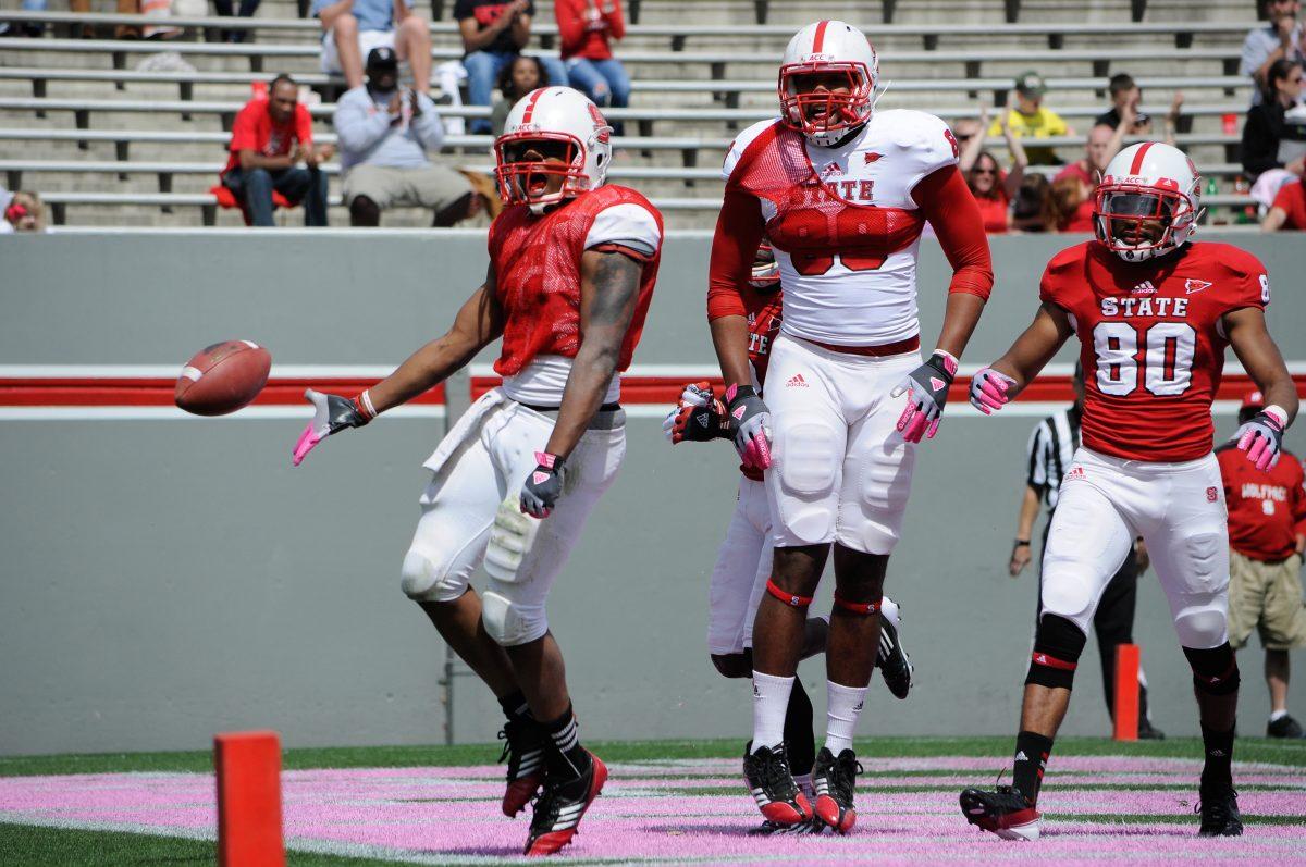 Redshirt senior safety Jarvis Byrd celebrates after a returning an interception for a touchdown April 20, 2013 at Carter-Finley Stadium during the Kay Yow spring football game.