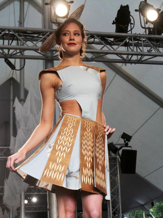 Senior in graphic design Brooke Odom poses at the end of the runway at Art 2 Wear in the Court of North Carolina April 25. Odom is wearing a cotton and wood design by junior in art and design Sarah Cannon. This was Cannon's third consecutive year participating in Art 2 Wear.&#160;