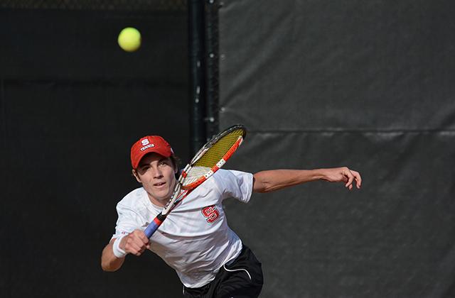 Junior Robbie Mudge smacks the ball back at his opponent. Robbie defeated Boston College in singles and doubles at the top position with his partner, freshman Ian Dempster at Dail Outdoor Tennis Stadium Friday. Head coach Jon Choboy talked about the team having to battle the wind, &#8220;We had a couple of different teams out there, but I thought they did a good job of getting through it.&#8221;