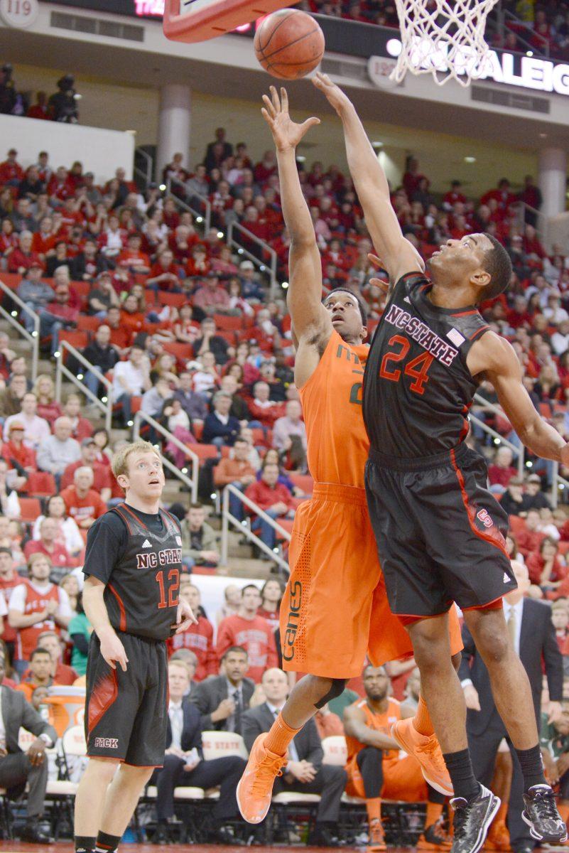 Sophomore forward T.J. Warren reaches for a rebound during the game against Miami in PNC Arena Saturday, Mar. 1, 2014. The Wolfpack fell to the Hurricanes, 85-70. Photo by John Joyner.