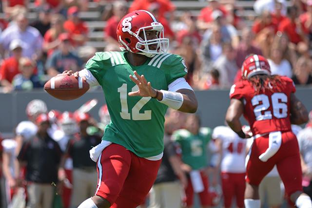 Redshirt junior quarterback Jacoby Brissett looks for an open receiver during the Kay Yow Spring Football game in Carter-Finley Stadium Saturday.&#160;