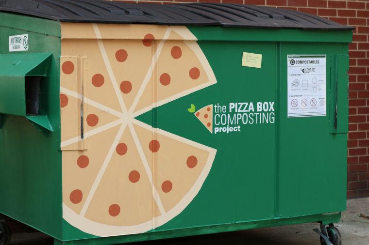 Pizza boxes can be composted in containers like this one located behind Bowen Hall. Students can dump their waste from pizza boxes, including uneaten slices, into the dumpster. Photo by Sam Whitlock.