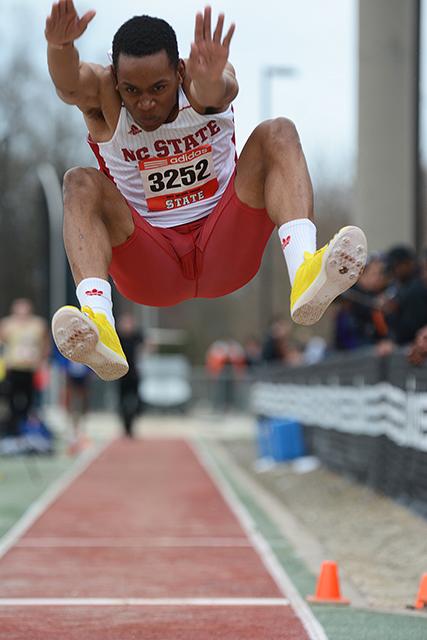Sophomore Jonathan Addison leaps into the sand pit during his long jump at the Raleigh Relays on March 28. Addison won the individual title in men&#8217;s long jump at the ACC Championships Thursday, jumping a distance of 7.62 meters, which gave N.C. State its first individual title in men&#8217;s long jump in seven years.&#160;