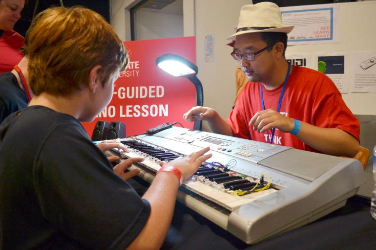 The Maker Faire, that was hosted on Saturday June 7 at the North Carolina Fair Grounds, served as an opportunity for the community to showcase invention and innovation, including many NC State students. One of the many DIY projects on display was an LED piano that guides lessons by flashing a light on what key should be played.