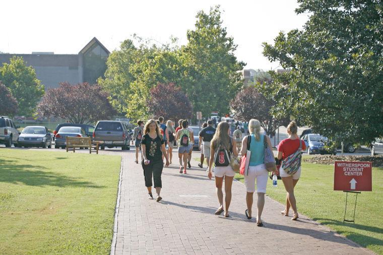 Incoming freshman and parents walking around campus on Wednesday July 24, 2013.