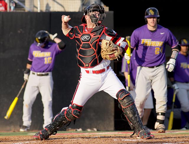 Junior catcher Brett Austin thows the ball before the N.C. State 3-2 victory over East Carolina on April 2 2014. &#160;Austin has recently begun his professional career with the Kannapolis Intimidators.