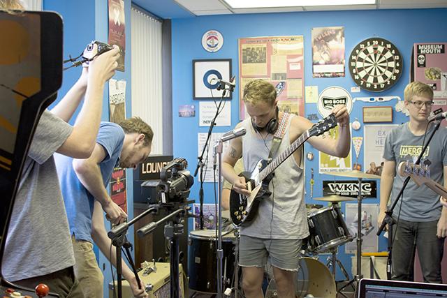 WKNC&#8217;s The Lounge crew sets up its recording equipment for indie rock band Wing Dam in the WKNC lounge on July 7.&#160;