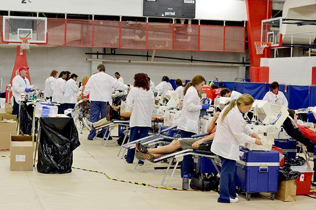 A long line of Double Red Cell donors is attended to at the 2013 Service N.C. State Blood Drive held Friday August 23, 2013 in Carmichael Gymnasium. The drive returned this year, aiming to collect 5,000 pints in total since its start in 2010.&#160;
