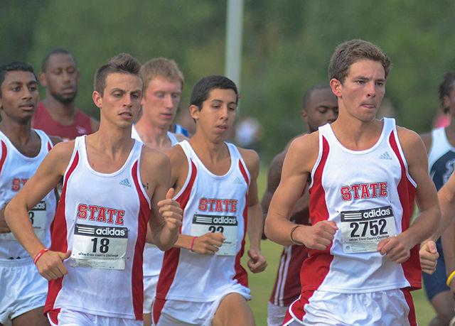 Members of the N.C. State cross country team take off during the start of the Adidas Cross Country Challenge.
