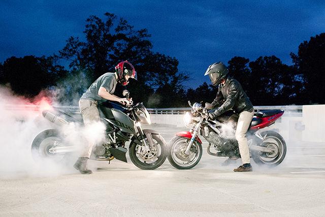 John Paton, junior in textile technology, and Spencer Vaughn, chemical engineering, do a nose-to-nose burnout.