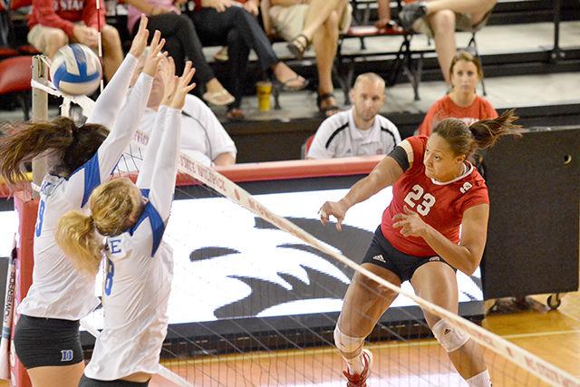 Junior outside hitter Dariyan Hopper spikes the ball during the volleyball match against Duke in Reynolds Coliseum.