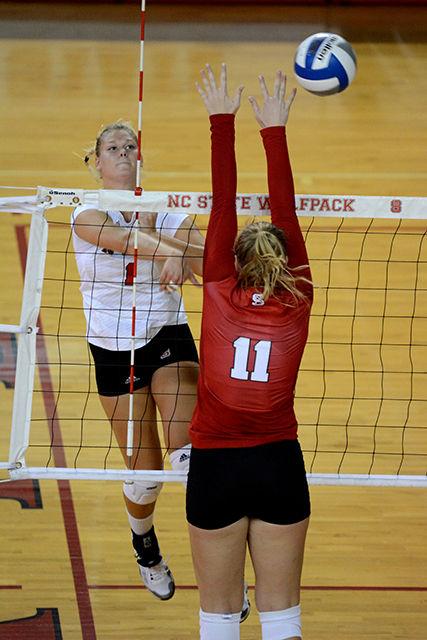 Freshman outside hitter Julie Varga hits the ball back at her fellow teammates. The NC State volleyball team hosted a red verse white game Friday, Aug. 22, 2014. Photo by Joseph Phillips