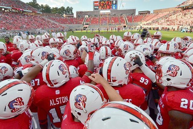 The Wolfpack huddles up prior to a game at Carter-Finley Stadium. Listen live on Aug. 30 at 10:30 a.m. for coverage of State&#8217;s matchup with Georgia Southern.