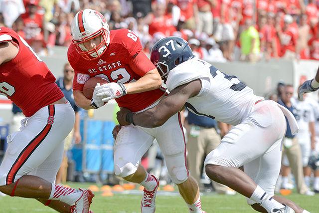Freshman wide receiver Bo Hines runs the ball during the game against Georgia Southern in Carter-Finley Stadium Saturday, Aug. 30, 2014. The Wolfpack defeated the Eagles, 24-23. Photo by John Joyner.