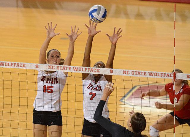 Freshman middle blocker Kaitlyn Kearny and freshman outside hitter Perry Ramsey defend against Coastal Carolina on Friday in Reynolds Colliseum. The Wolfpack defeated the Chanticleers 3-0.