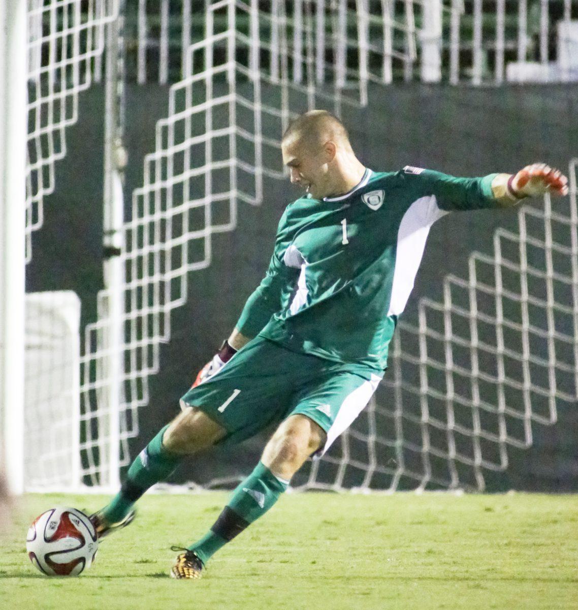Junior goalkeeper Alex McCauley starts off the wolfpacks movement forward with a goal kick. The wolfpack beat Cleveland State 4-0. Photo by Nick Faulkner