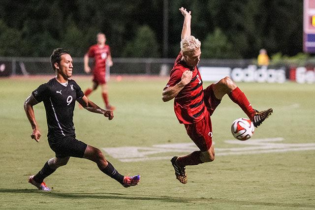 Freshman defense Caleb Duvernay takes control of the ball from the Cleveland State offense. The Wolfpack beat Cleveland State 4-0.