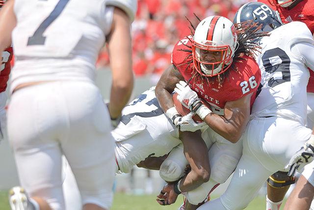Graduate student running back Tony Creecy fights through the defensive line during the game against Georgia Southern in Carter-Finley Stadium Saturday. The Wolfpack defeated the Eagles, 24-23.