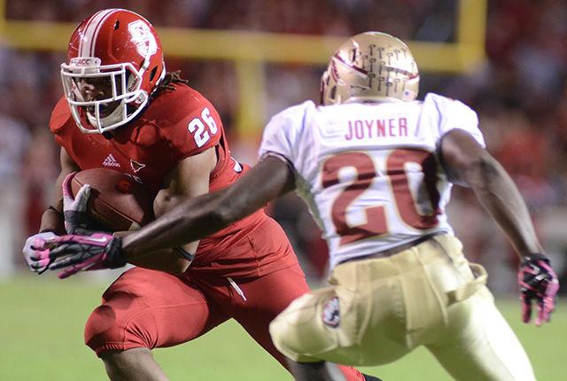 Graduated running back Tony Creecy drives down the field during the third quarter against Florida State. Creecy rushed for 34 yards in the Wolfpack&#8217;s 17-16 win over the Seminoles Oct. 6, 2012 at Carter-Finley Stadium Stadium.