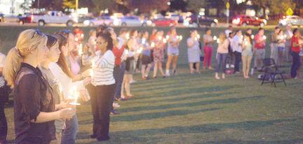 The Suicide Awareness Candlelight Vigil held on Wednesday on Harris Field, drew a large group of victims and supporters to raise awareness about suicide.