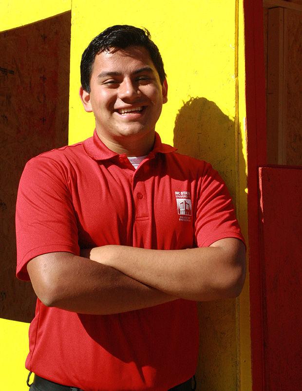 Senior Growing Cartagena poses in front of the multicultural shack Monday morning.