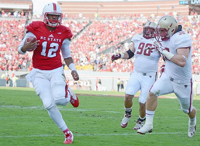 Redshirt junior quarterback Jacoby Brissett runs downfield while being chased by Boston College players Saturday, Oct. 11 at Carter-Finley Stadium.&#160; The Eagles defeated the Wolfpack 30-14. Brissett went 14-for-30, throwing for 174 yards and one touchdown completion in the loss.