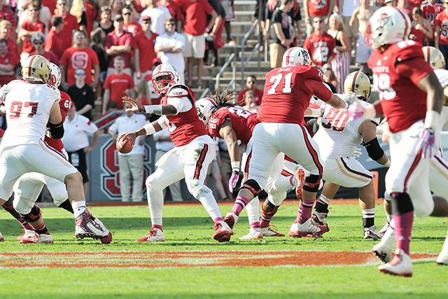 Redshirt junior quarterback Jacoby Brissett throws the ball during N.C. State&#8217;s game against Boston College Saturday, Oct. 11. Brissett threw for 174 yards and one touchdown in the Wolfpack&#8217;s 30-14 loss to the Eagles at Carter-Finley Stadium.