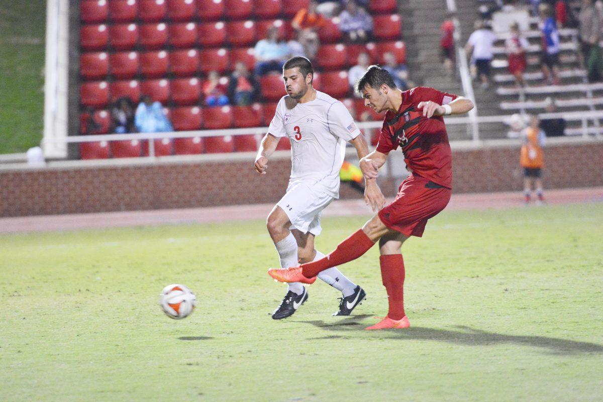 Reed Norton, defender for the wolfpack soccer team, scores the 4th goal at the soccer game vs Gardner-Webb held on October 7th in the Dail soccer stadium. Reed had a shot and a shot on goal and was in play for 48 minutes. The Wolfpack won 5-2 against Gardner-Webb. Photograph by Vibhavari Vempala.
