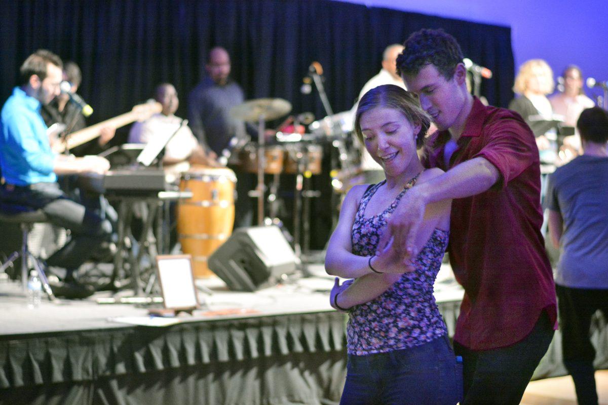 Sasha Hamrick, freshmen in business major, and Reuben Valerian, junior in electrical engineering, dance to the tunes of latin music at the event Salsabor under the stars which took place on Saturday, October 25th in the talley ballroom. The event began with an overview of Latin dances and featured a live salsa band, Orquesta Gardel.