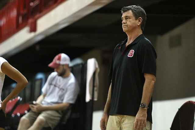 Head coach, Bryan Bunn watches as his team practices during the Red v White scrimmage Friday, August 22, 2014 in Reynolds Coliseum. Photo by Sam Whitlock.