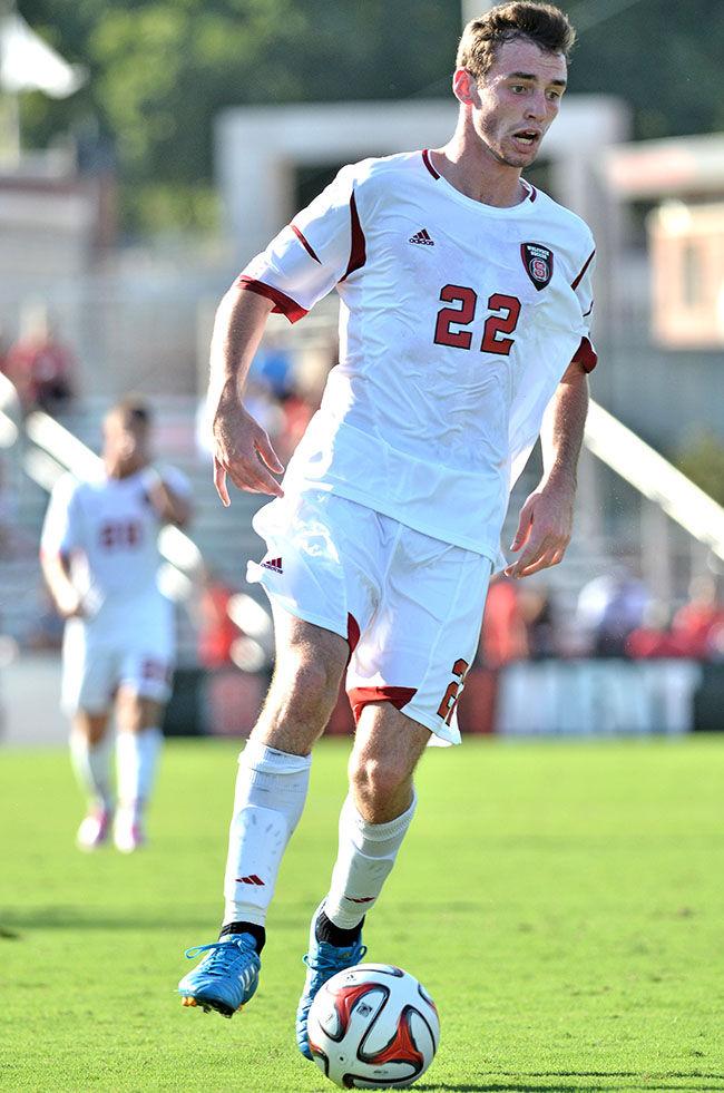 Freshman defender Conor Donovan cuts the ball against Cal Poly Sunday, Aug. 31. Donovan had one shot on goal in the Wolfpack's 3-1 loss to the Mustangs at Dail Soccer Field.