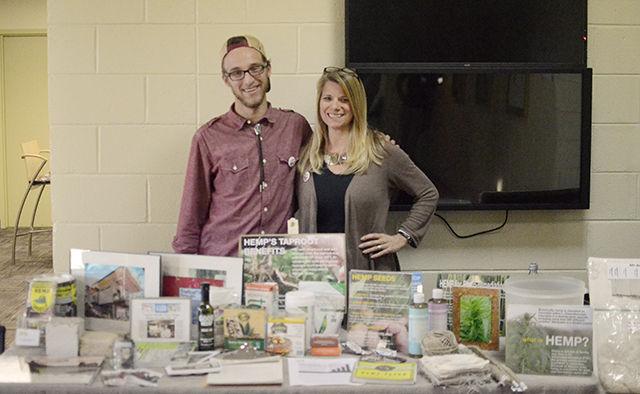 Andrew Klein (left), senior in natural resource policy and founder of the Raleigh Hemp Society, and Linda Booker, co-producer and co-director of the documentary,"Bringing It Home," posing behind a display of the many applications of hemp. Raleigh Hemp Society organized the screening in Witherspoon Student Cinema Sunday. The documentary highlights the struggle to get industrial hemp legalized in the US.&#160;