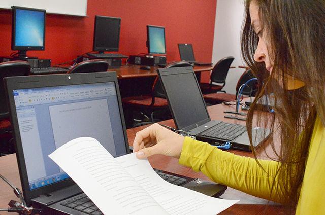 Vanessa Bateson, a Freshman in First Year College and a Mid-Distance runner on the Track &amp; Field team, proofreads a report for her english class in Case Academic Center on Oct. 14, 2014.