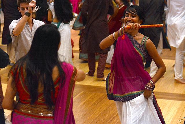 Meera Patel, senior in economics, takes part in the Triangle Garba dance Saturday evening, Oct. 4, 2014, in the Talley Ballroom. Garba is a traditional Indian folk dance originating in Gujarat. The dance was sponsored by EKTAA of NCSU, Sangam of UNC-Chapel Hill, and Diya of Duke.