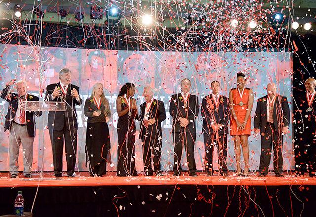 The NC State Athletic Hall of Fame Class of 2014 stands onstage to be recognized as a group at the end of the induction ceremonies in Talley Student Union Friday, Oct. 10.
