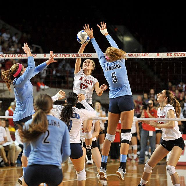 Junior setter Tanna Aljoe spikes the ball against UNC Friday. Aljoe had three spikes in the Wolfpack's 3-0 loss to the Tar Heels at Reynolds Coliseum.