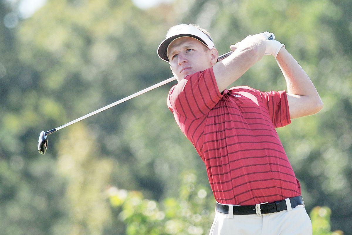 Junior golfer David Cooke tees off of the 12th hole at Lonnie Poole Golf Course Monday, October 6, 2014 during round one of the Wolfpack Intercollegiate. Cooke finished round one tied for 8th place with a score of even. Photo by Ryan Parry.