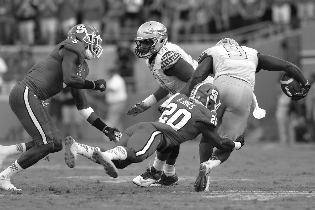 John joyner/TechnicianRedshirt junior safety Hakim Jones tackles the ball carrier during the game against then-No. 1 Florida State in Carter-Finley Stadium Sept. 27. Despite a strong start, the Wolfpack fell to the Seminoles by a score of 56-41. The &#8216;Noles rank first in the Atlantic Division of the Technician&#8217;s ACC power rankings. NC State is sixth in the Atlantic.