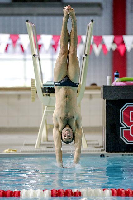 Freshman Harrison Mitchell executes excellent entry into the water to garner 2nd place in 1m diving with a total score of 329.10 during the Wolfpack's meet against Georgia Oct. 18.