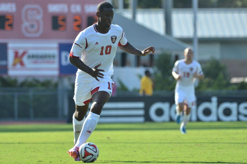 Freshman forward Ade Taiwo dribbles down the field against Cal Poly Sunday, Aug. 31. Taiwo had four shots in the Wolfpack&#8217;s 3-1 loss to the Mustangs at Dail Soccer Field.
