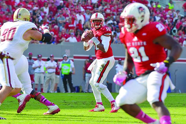 Redshirt junior quarterback Jacoby Brissett prepares to pass the ball during the game against Boston College in Carter-Finley Stadium Saturday, Oct. 11, 2014. Brissett completed 14 passes in 30 attempts for a total of 174 passing yards in the Wolfpack's 30-14 loss the the Eagles. Photo by John Joyner.