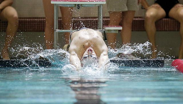 Freshman Hennessey Stuart took a very close third place in the men's 100 backstroke with a time of 49.19 seconds. The Wolfpack won the heat and the meet against Georgia on October 18th, 2014.